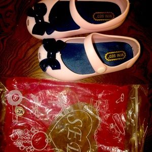 SED rubber baby girl bow shoes.  Never worn